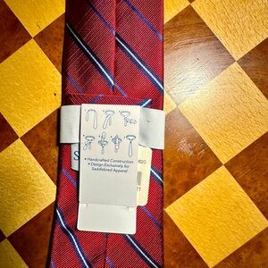 NWTO Saddlebred tie featuring a classic red and blue striped pattern.